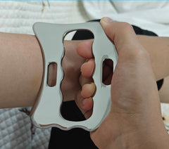 Robulove scraper with narrow edge and contoured shapes for different muscle groups.