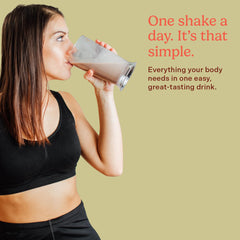 ROCK THE SHOT GLP-1 chocolate shake scoop beside blender for on-the-go nutrition