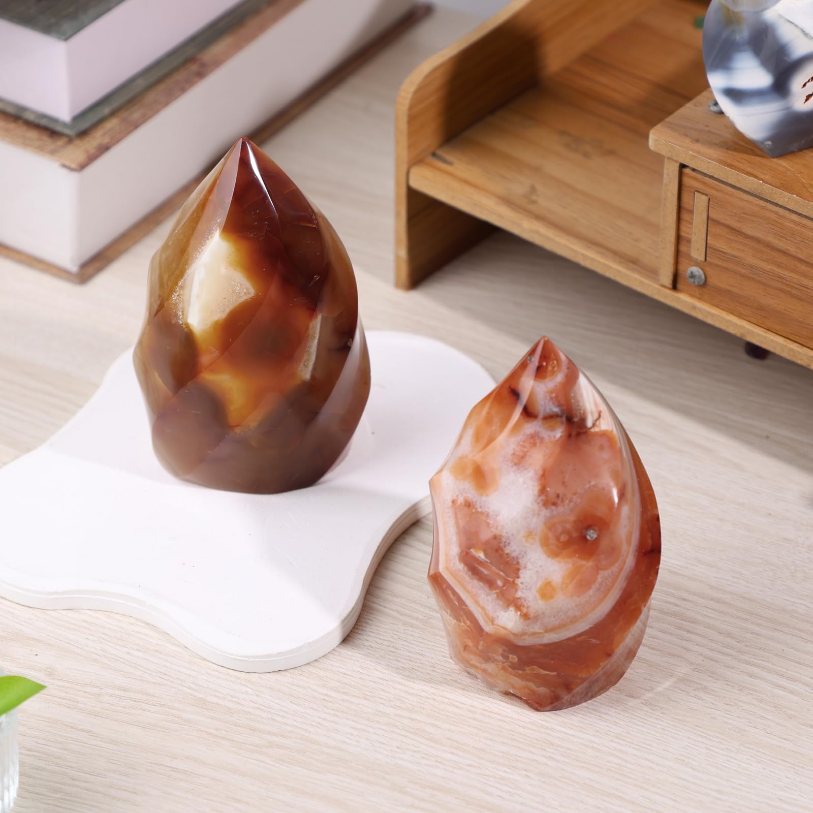 Rockcloud Carnelian Flame Tower on its smooth base for stable display.
