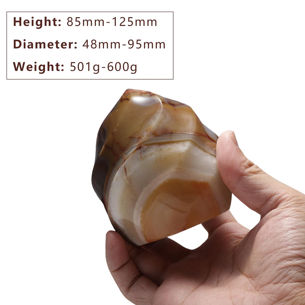 Rockcloud Carnelian Flame Tower in hand during meditation for focus.