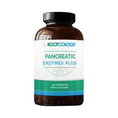 Rootcology Pancreatic Enzymes Plus bottle on table supports digestion after meals.