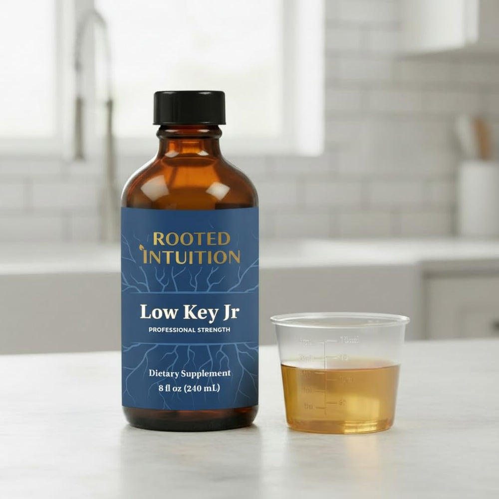 Close-up of Rooted Intuition Low Key Jr label with natural ingredients