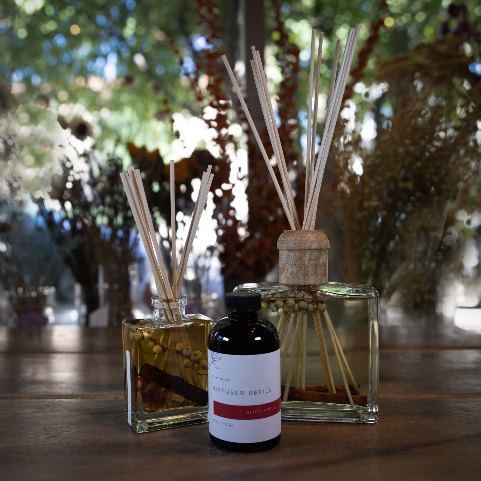 Rosy Rings Spicy Apple diffuser oil bottle close-up highlighting label and scent