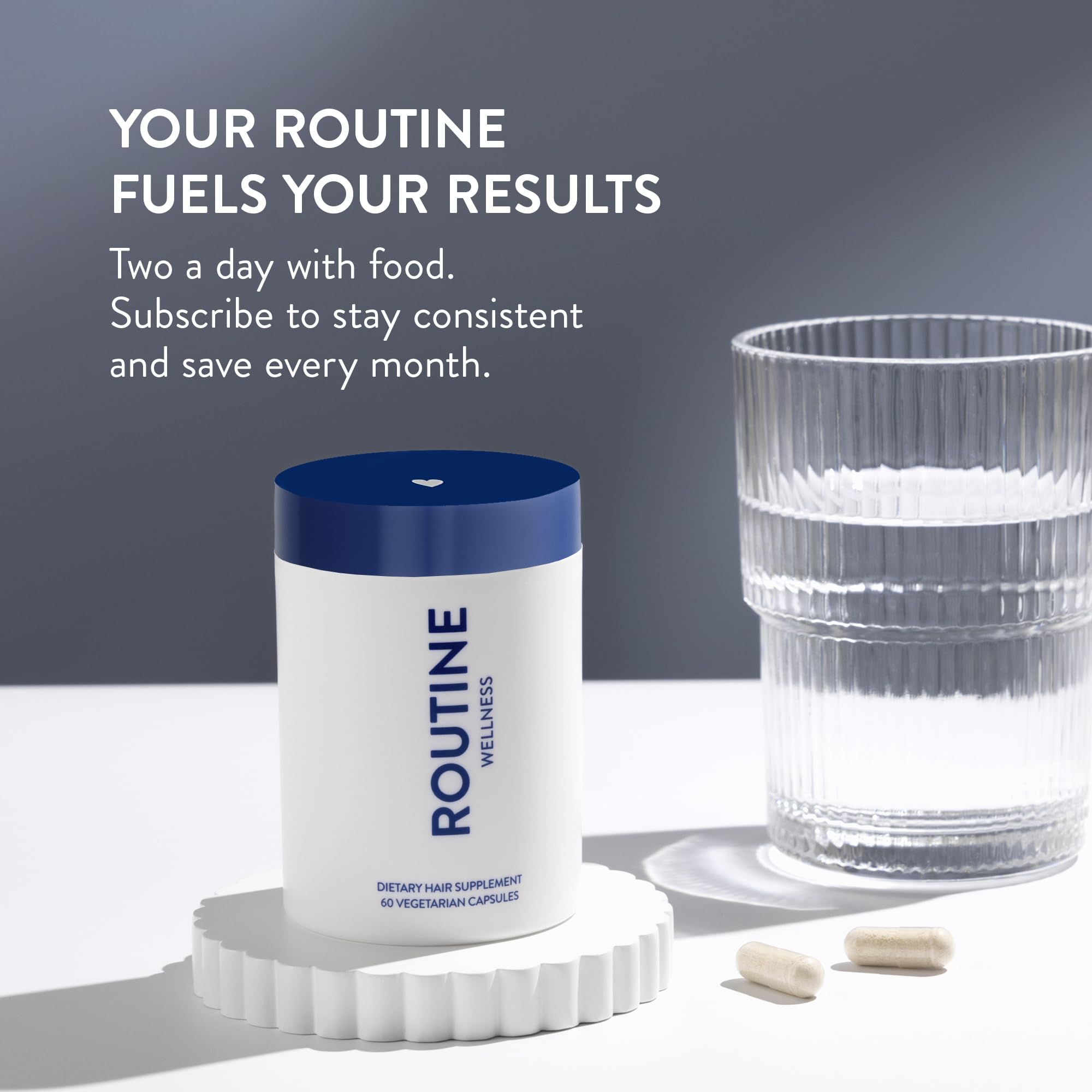 Routine Wellness softgel capsules in hand suggest simple daily intake