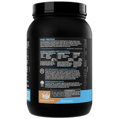 Rule 1 Whey Protein powder dispensed into a shaker for quick post-workout mix