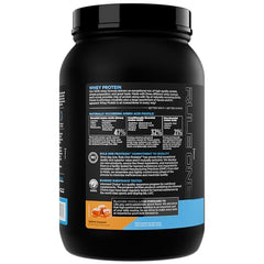 Rule 1 Whey Protein salted caramel powder in a scoop
