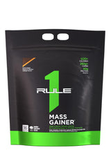 Rule1 Mass Gainer bottle shows 1,220 calories per serving for steady energy.