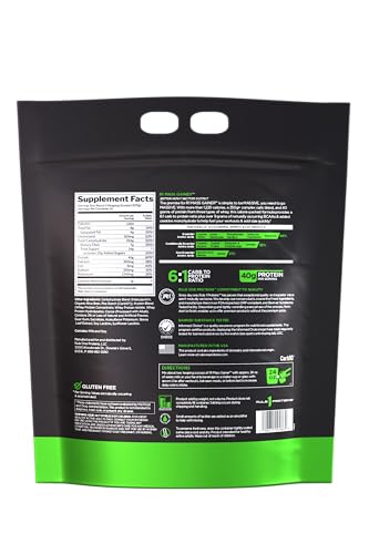 Rule1 Mass Gainer scoop beside powder for quick mass-building shakes.