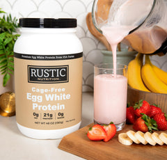 Rustic Nutrition egg white protein powder scoop on counter for quick smoothie mixing