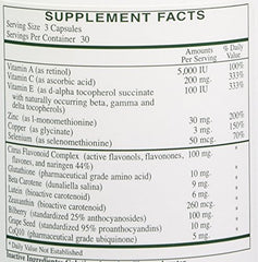 Rx Vitamins Ocular Formula bottle on desk beside reading glasses for daily eye support
