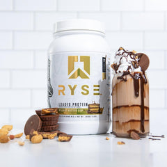 RYSE Loaded Protein Peanut Butter Cup label close-up emphasizes low sugar and clean ingredients