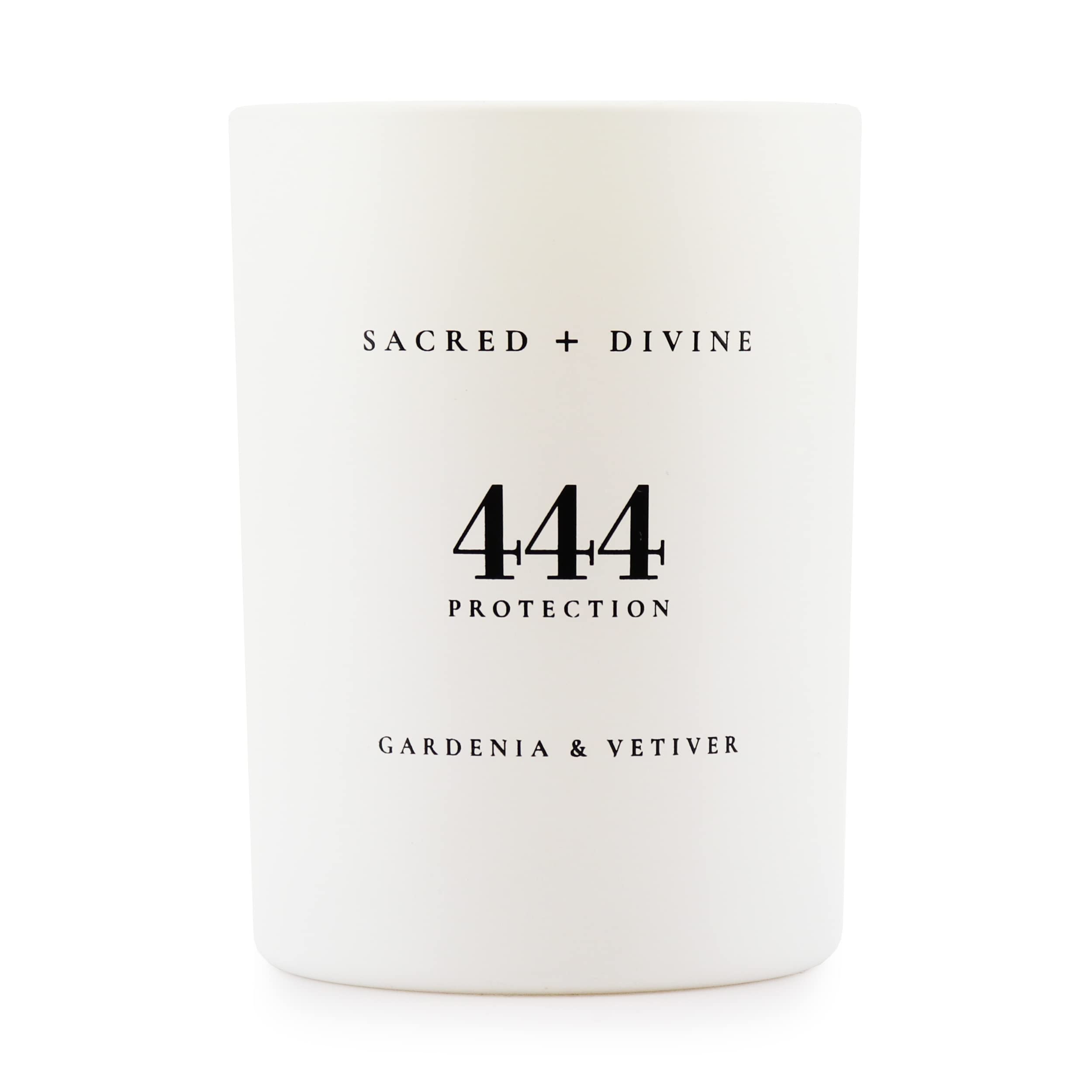 Sacred Divine 444 candle with gardenia and vetiver in a white jar enhances mood.