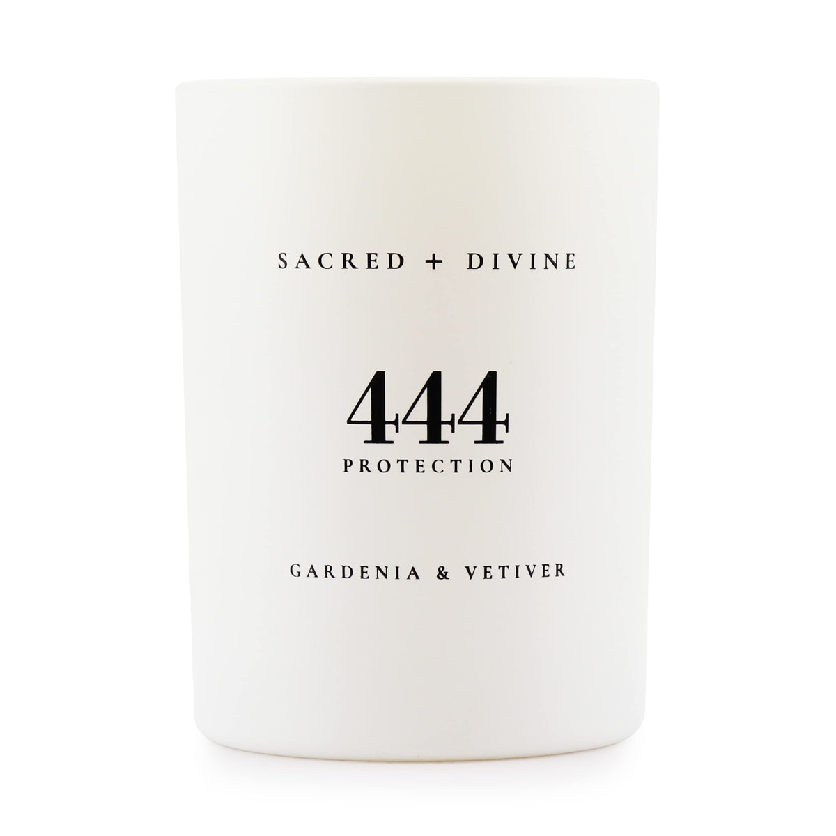 Sacred Divine 444 candle with gardenia and vetiver in a white jar enhances mood.
