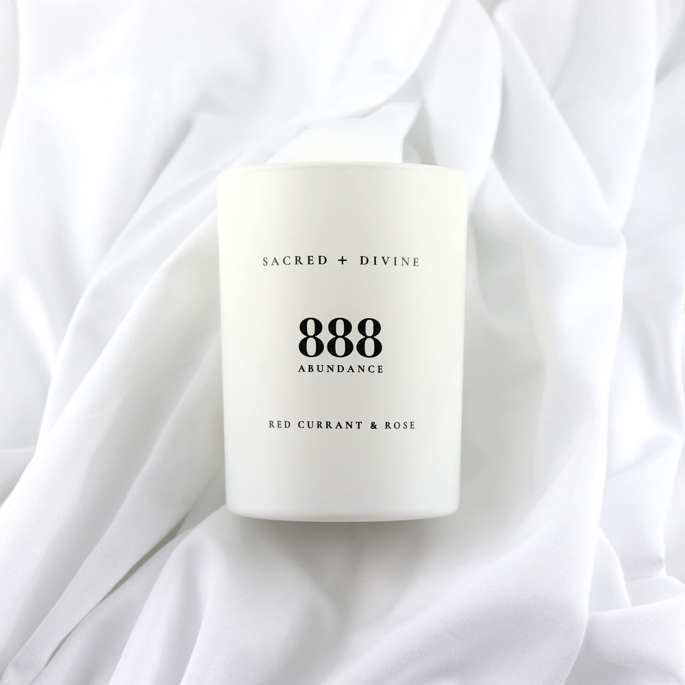 Sacred + Divine 888 abundance candle gift box packaging ready for gifting.
