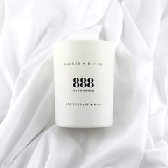 Sacred + Divine 888 abundance candle gift box packaging ready for gifting.