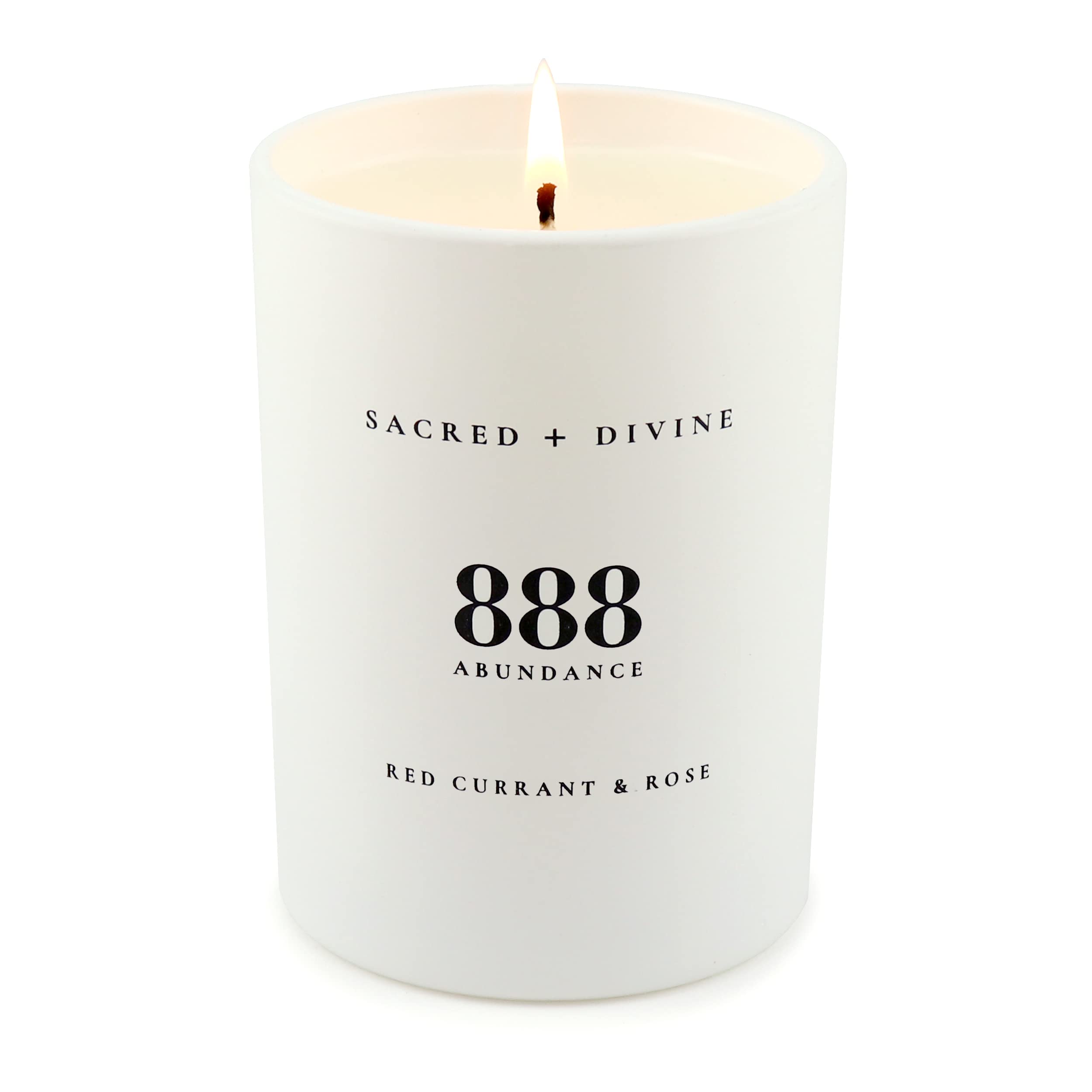 Sacred + Divine 888 abundance candle jar surface showing minimalist design.