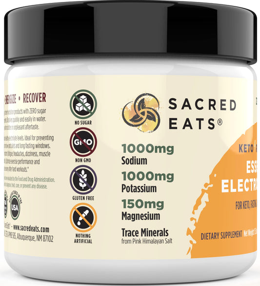 Sacred Eats Mango electrolyte powder dissolving in water for quick, sugar-free hydration.