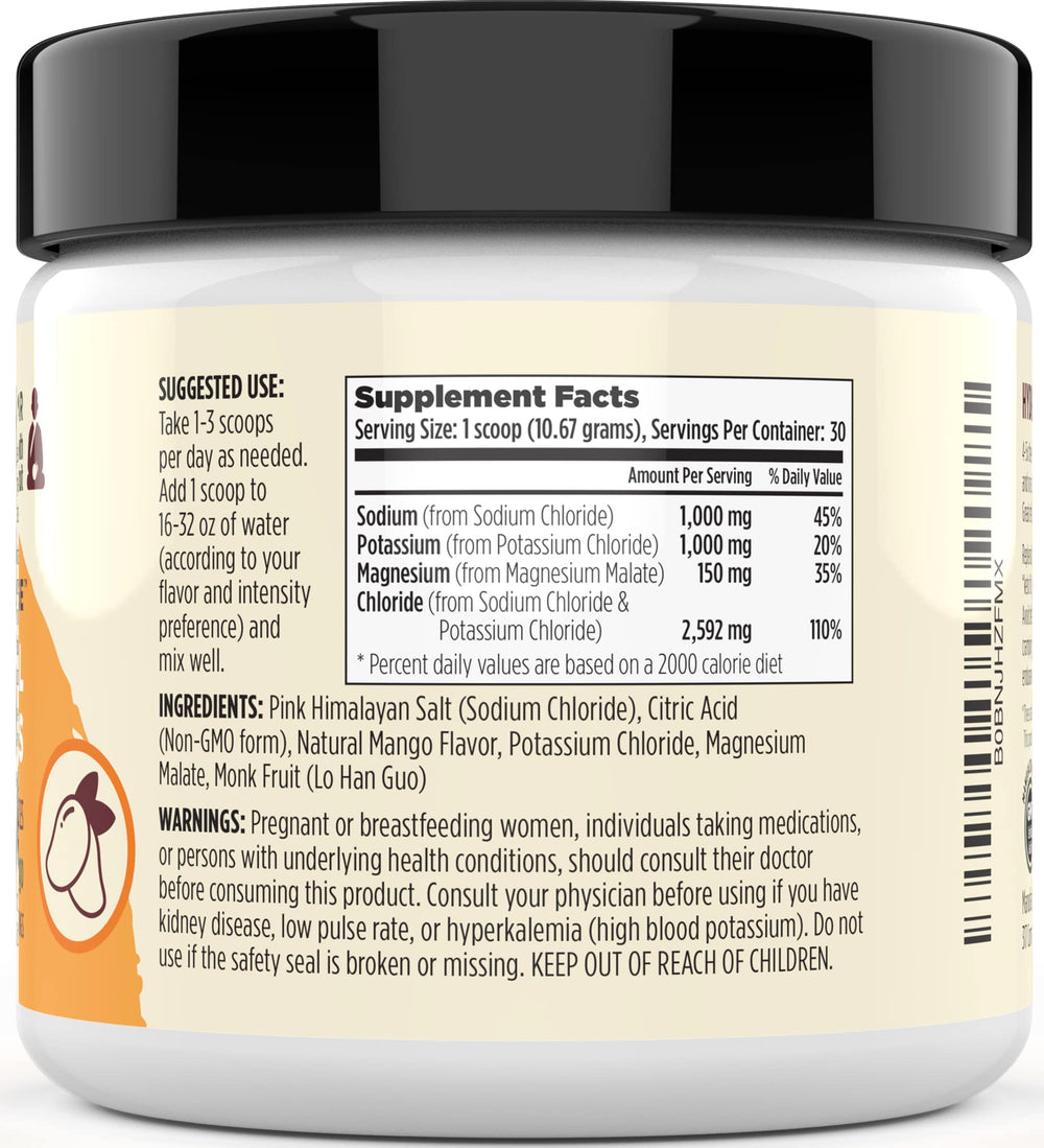 Mango electrolyte powder mixed in a glass after stirring for refreshing hydration.