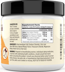 Mango electrolyte powder mixed in a glass after stirring for refreshing hydration.