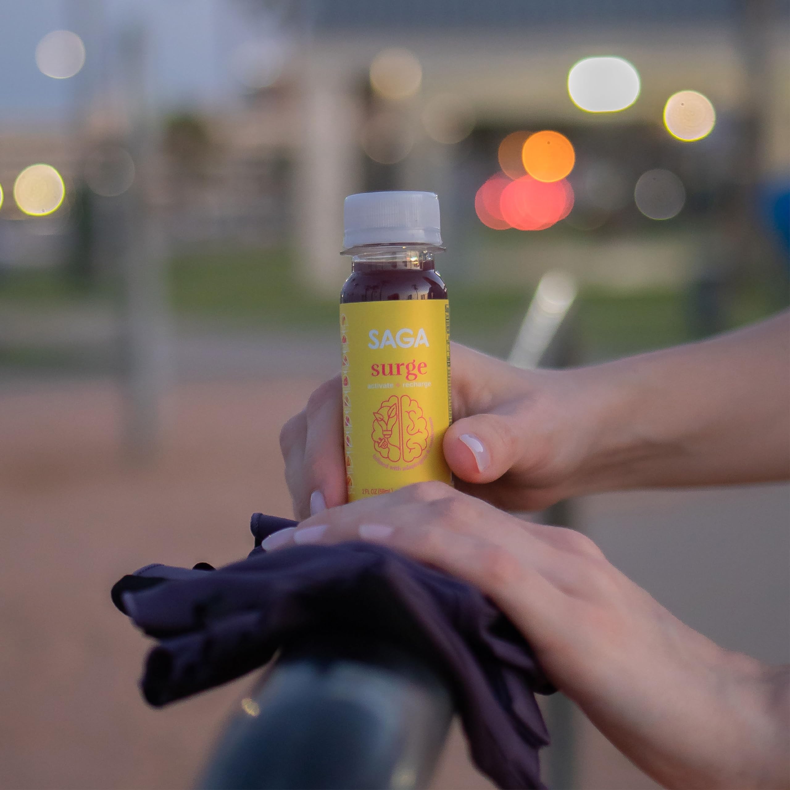 SAGA Surge Peach Mango pour showcases fast-acting energy for on-the-go tasks.
