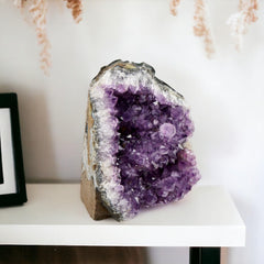 SAMSARI amethyst geode showcasing varied shapes and colors as art.