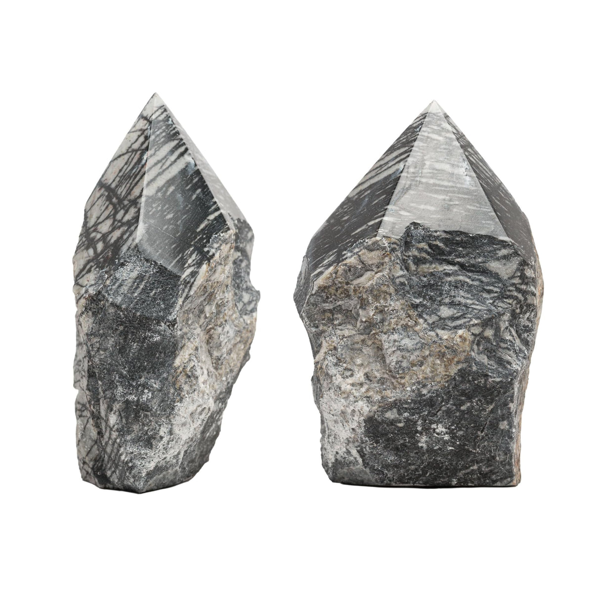 SAMSARI Net Jasper point pair closeup reveals earthy grounding patterns.