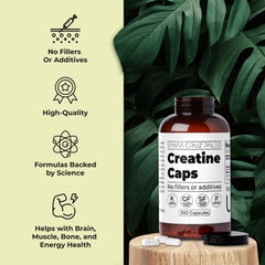 Creatine capsules poured into palm by Santa Cruz Paleo