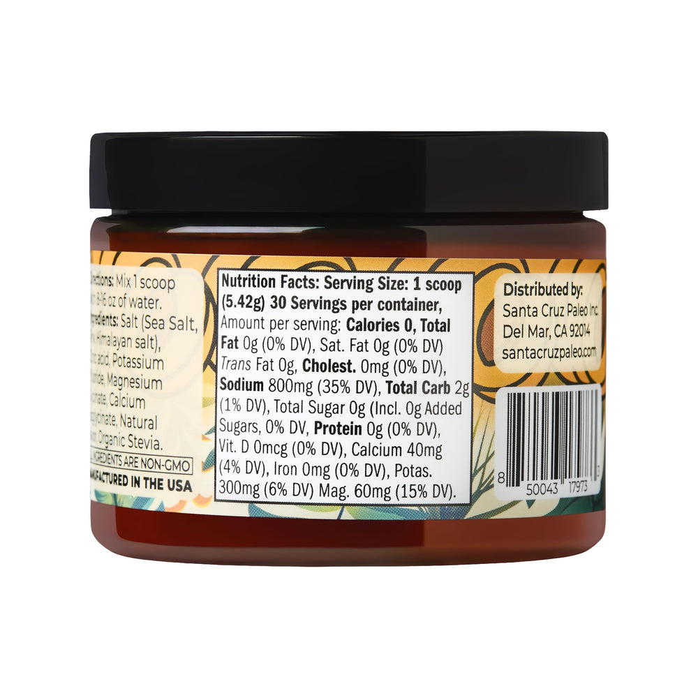 Santa Cruz Paleo electrolyte powder scoop next to a glass of water