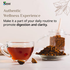 Sayan chaga tea brewing scene with amber infusion and inviting aroma