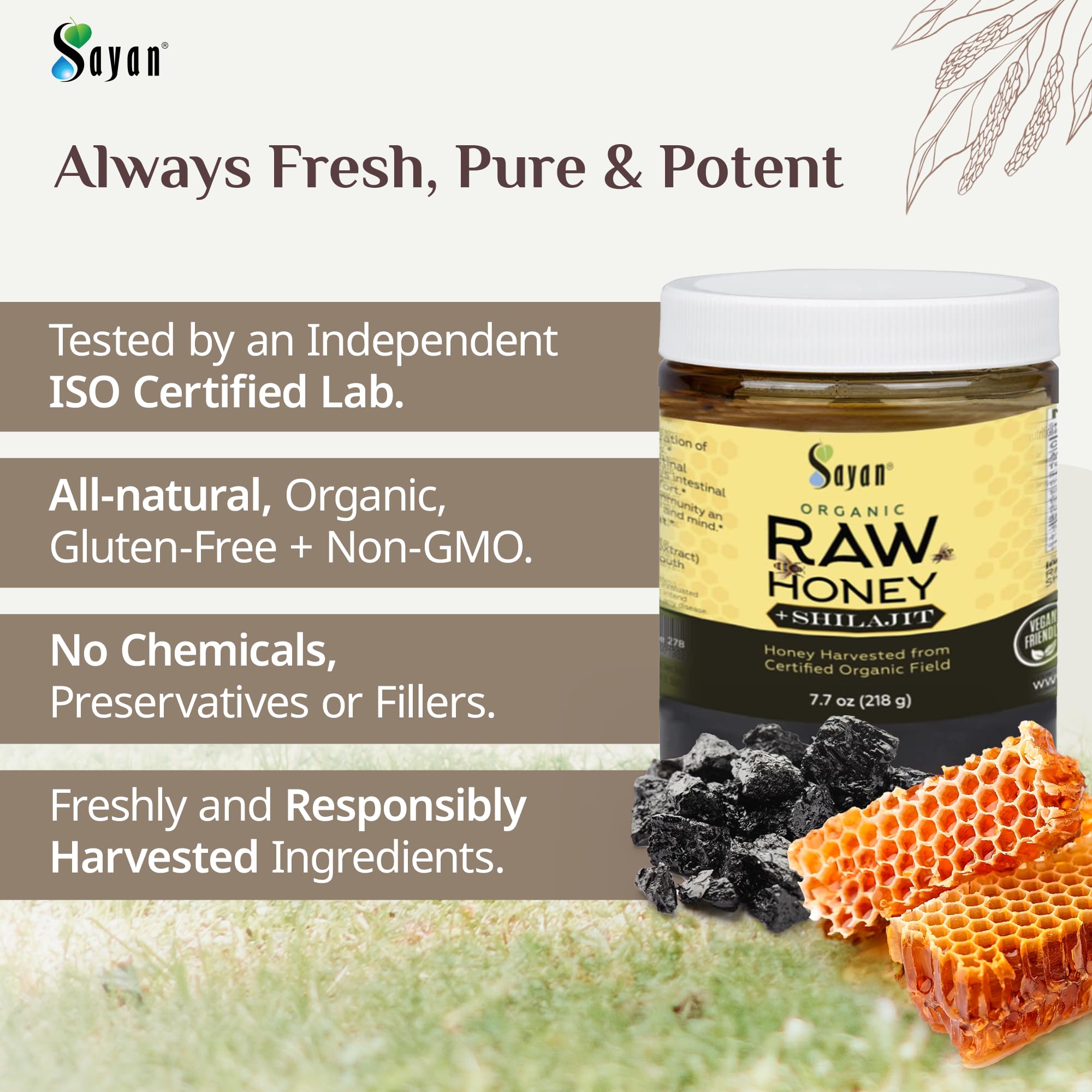 Sayan organic raw honey bottle glows amber with natural sweetness.