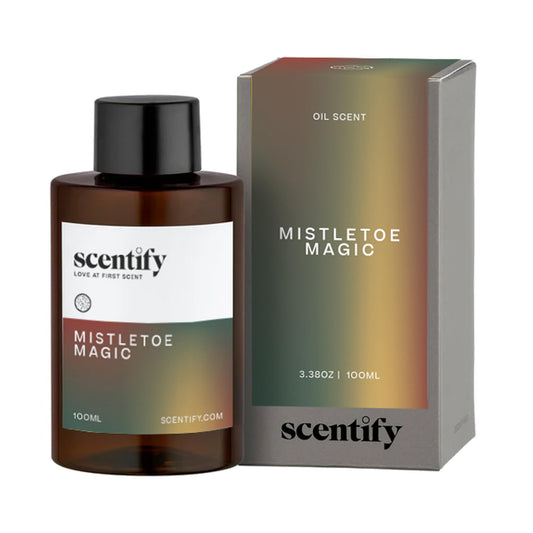 Scentify Mistletoe Magic diffuser oil bottle with weathered pine cone notes for cozy winter spaces.