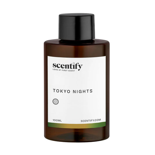 Scentify Tokyo Nights bottle closeup features amber bottle design for luxury mood.