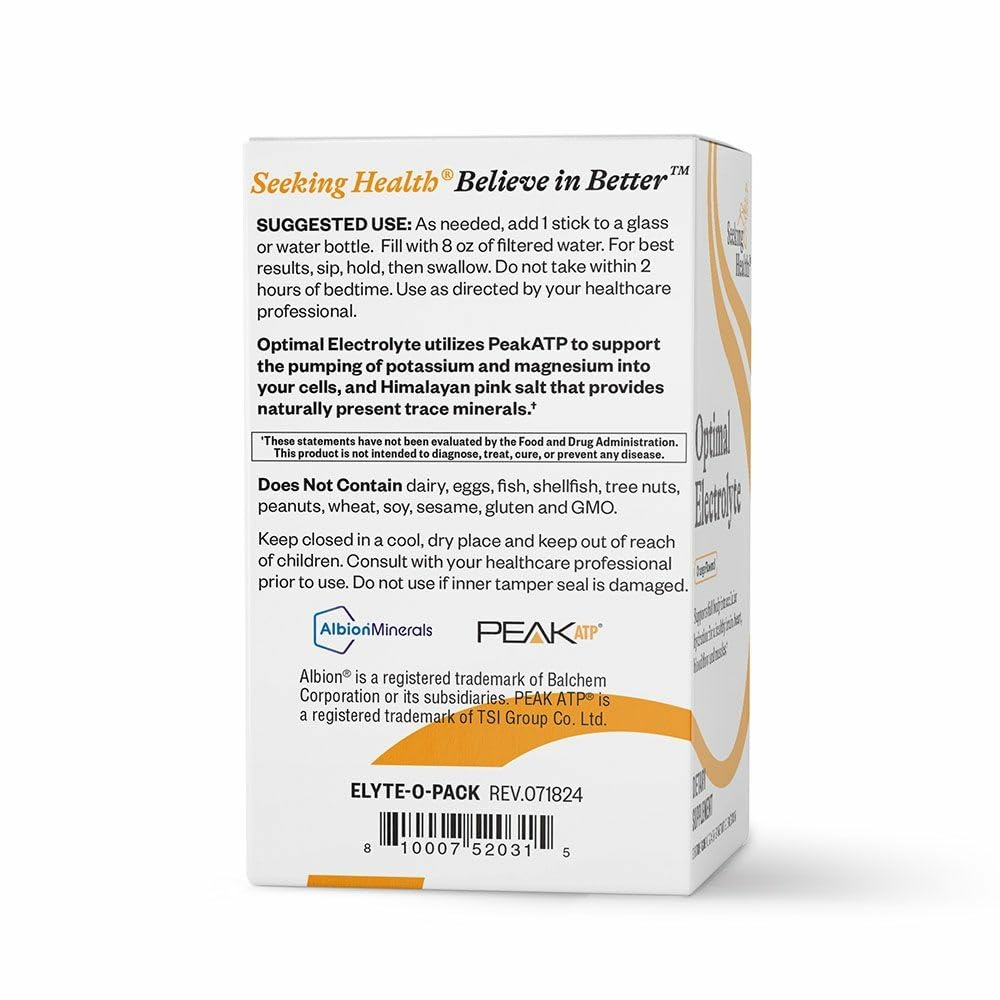 Seeking Health Optimal Electrolyte Sticks glass with orange drink after activity.