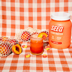 SEEQ Juicy Peach label close-up showing zero sugar and lactose-free features.