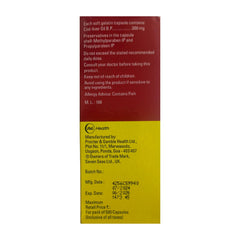 Pouring Seven Seas Cod Liver Oil capsules into hand for easy dose.