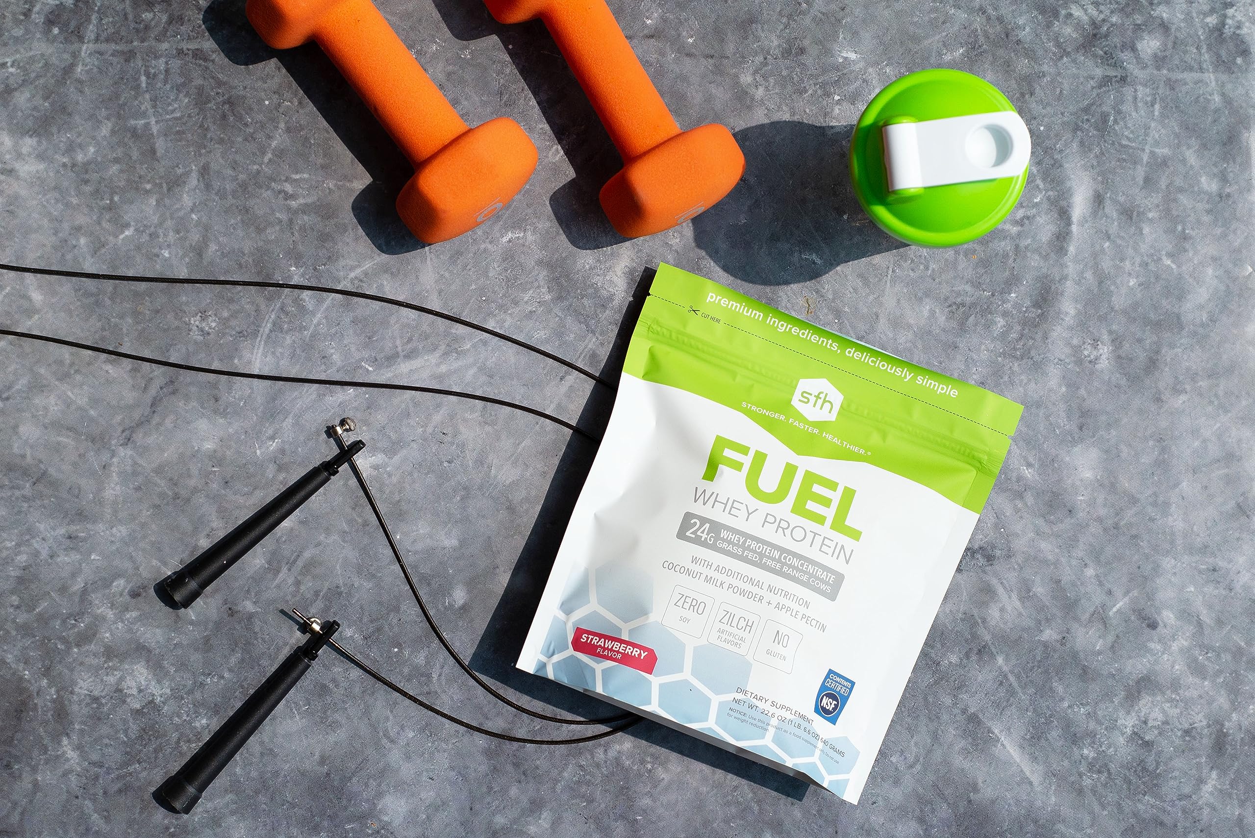 SFH Fuel strawberry powder with scoop suggesting delicious shakes.