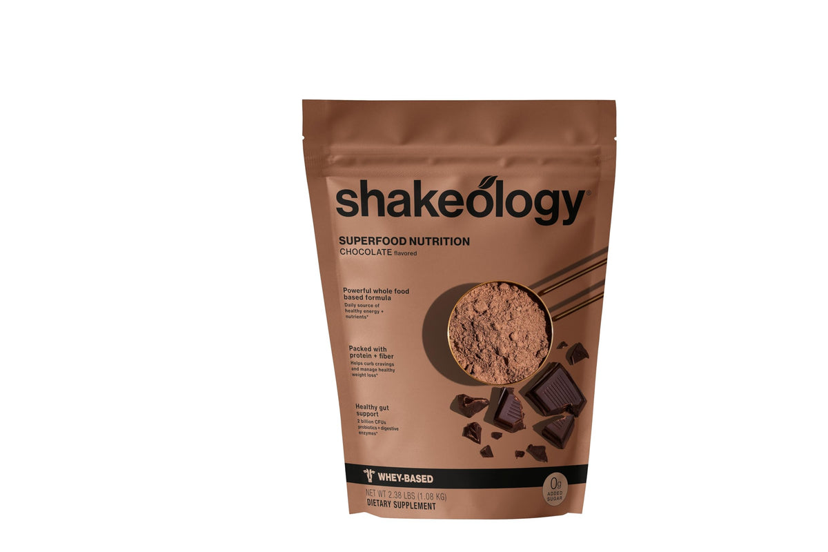 Shakeology chocolate whey protein bottle shows gluten-free formula for lean muscle support