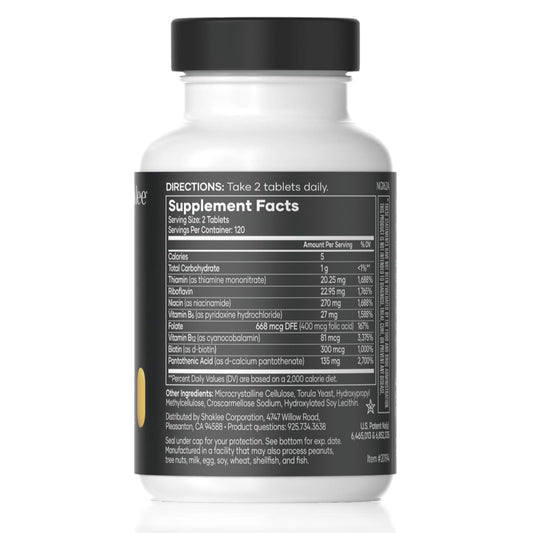 Shaklee B-Complex tablets closeup showing small, easy-to-swallow capsules