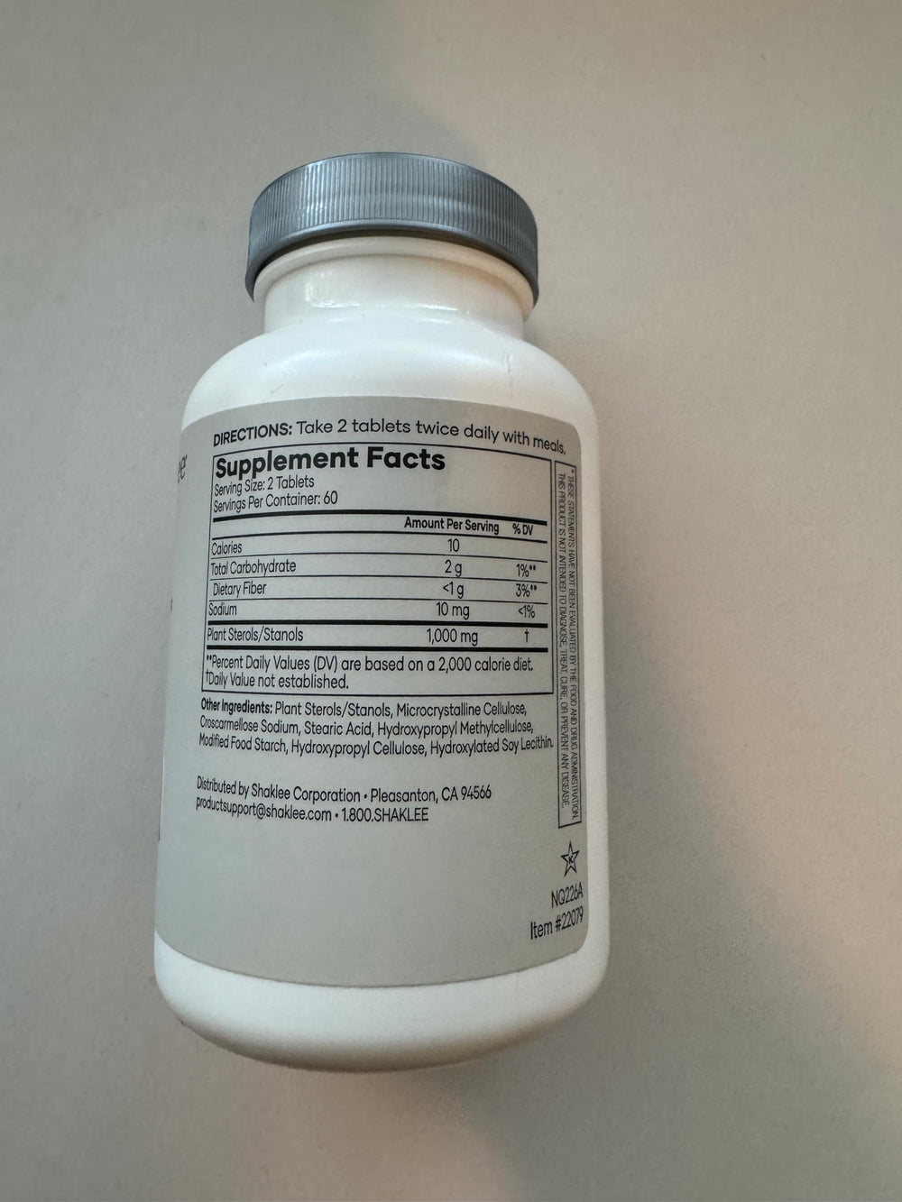 Shaklee Cholesterol Complex tablets close-up showing capsules for convenient daily use