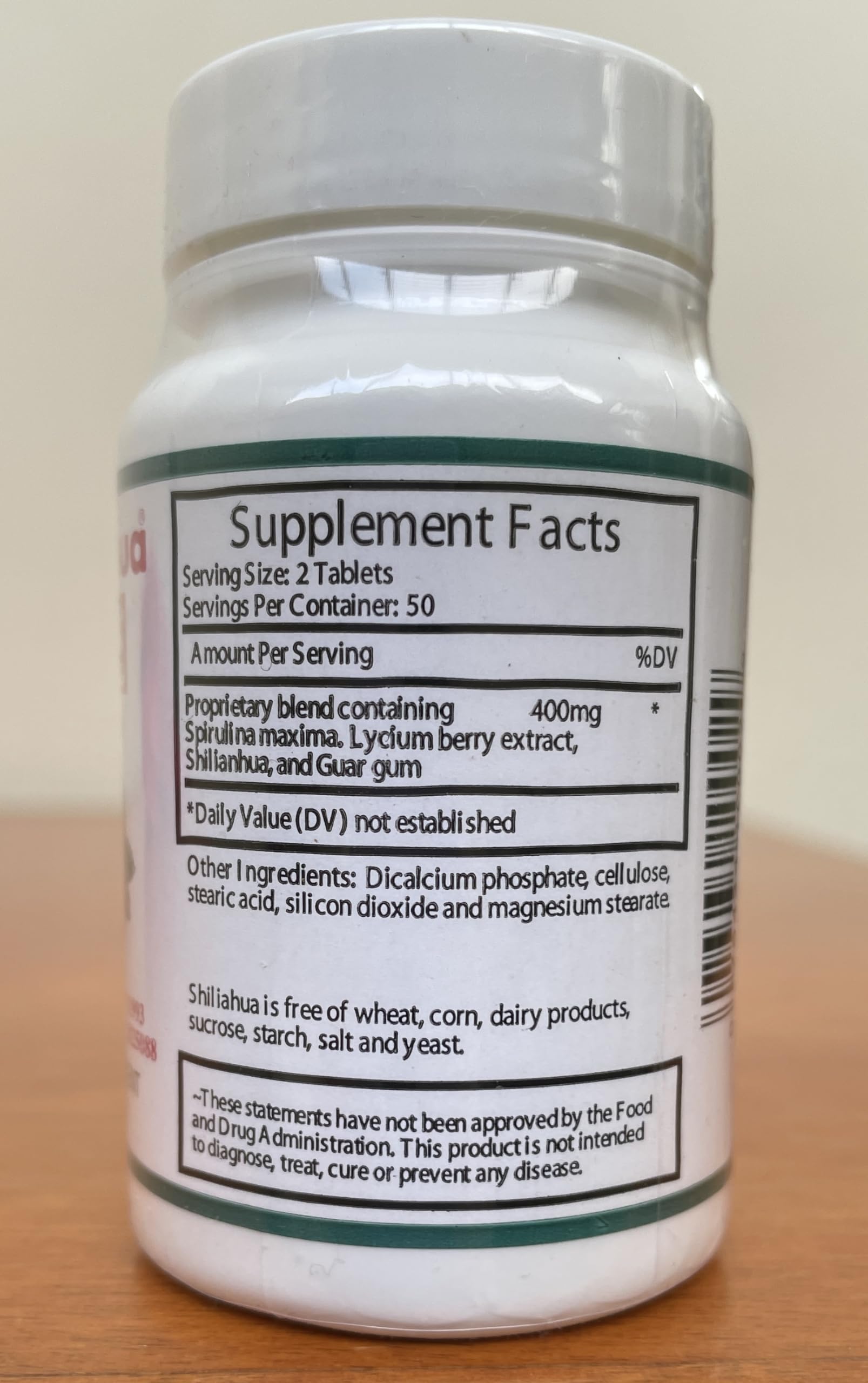 Shilianhua tablets in hand demonstrating convenient daily intake for wellness.