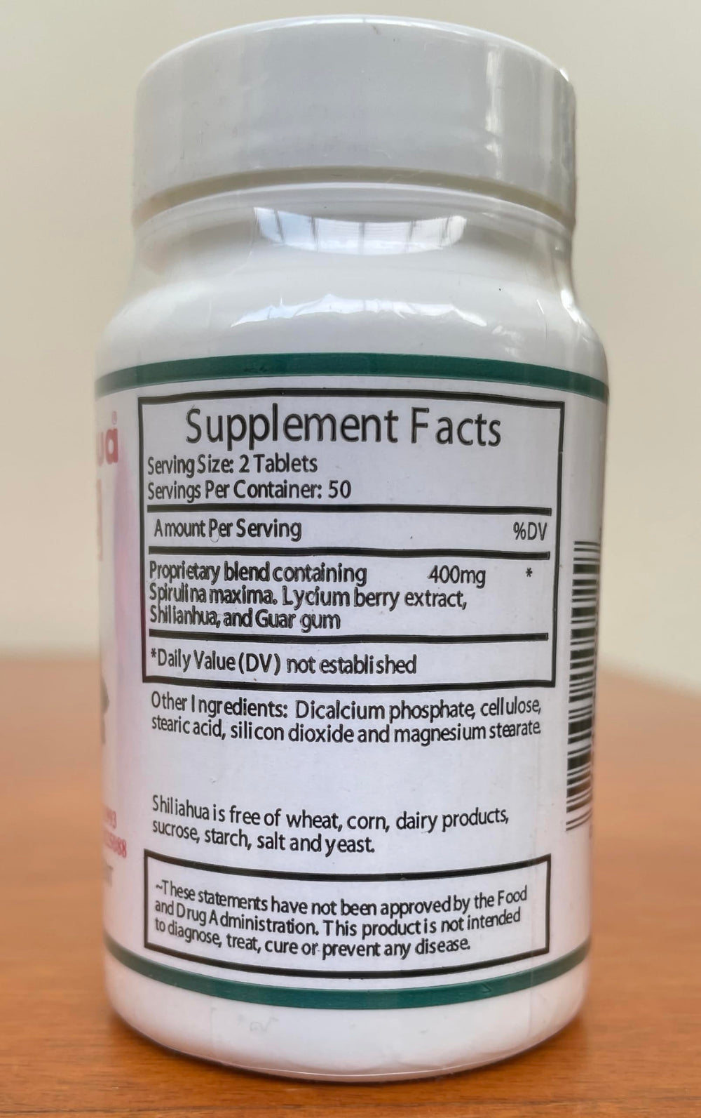 Shilianhua tablets in hand demonstrating convenient daily intake for wellness.