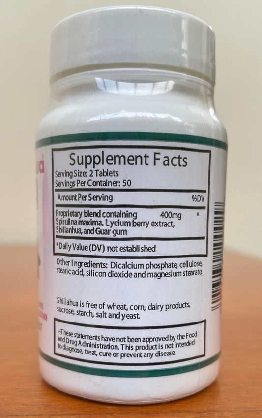 Shilianhua tablets in hand demonstrating convenient daily intake for wellness.