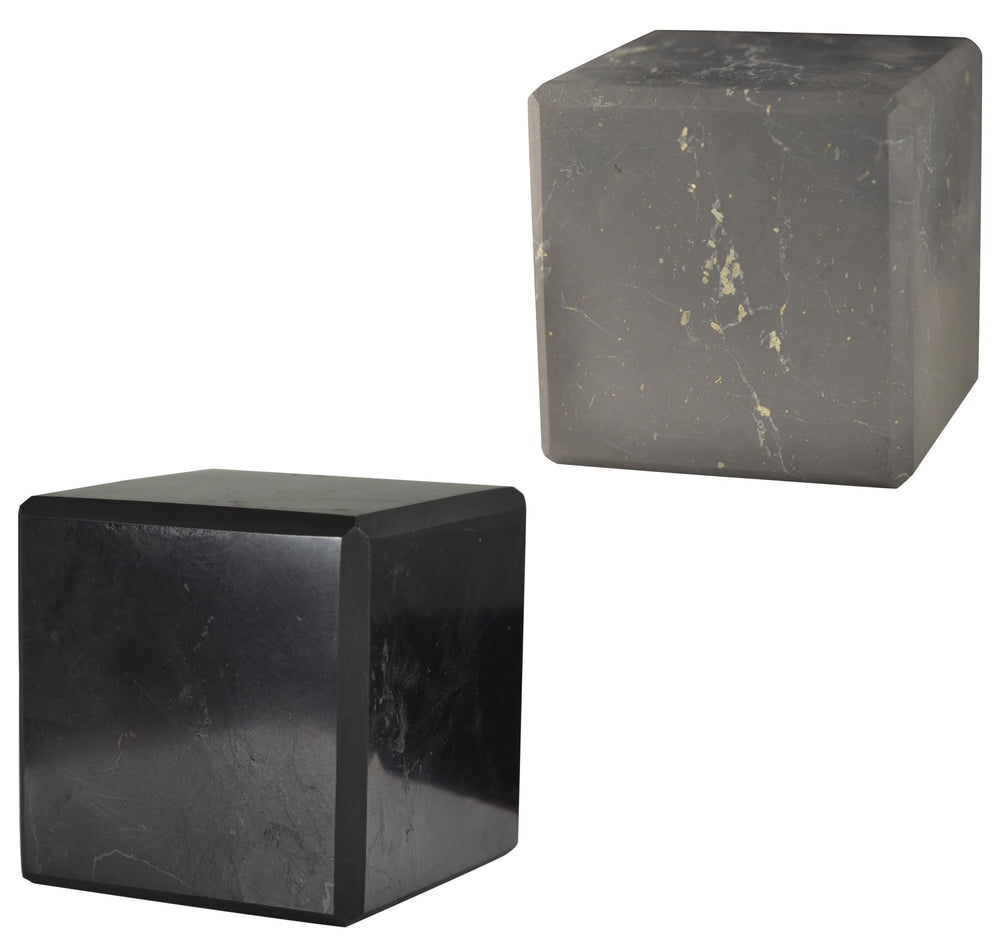 Shungite World polished cube 70mm on desk, grounding energy and protection.