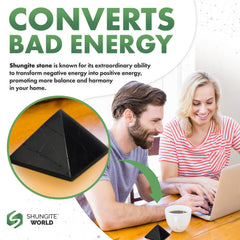 Shungite World 80mm pyramid on a dark wood shelf for grounded style.