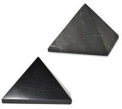Shungite World two-pcs pyramids polished and unpolished 110 mm on a sleek desk for focus
