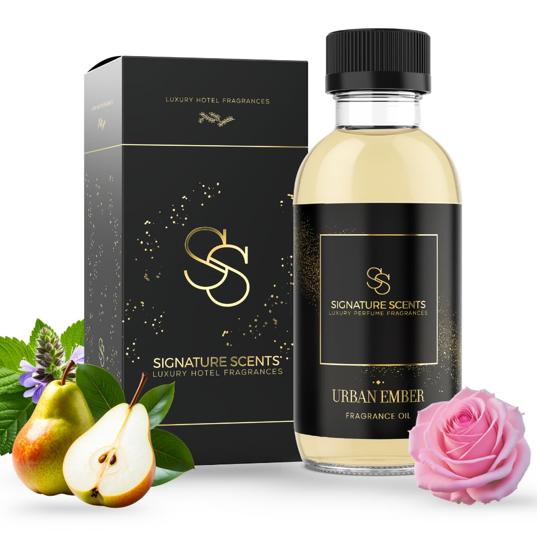 Signature Scents Urban Ember bottle pour showing long-lasting aroma for home spaces.