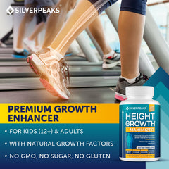 SILVERPEAKS Growth Capsules on a bright countertop with a glass of water.