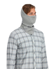 Simms BugStopper SunGaiter worn during fishing for sun and insect protection.