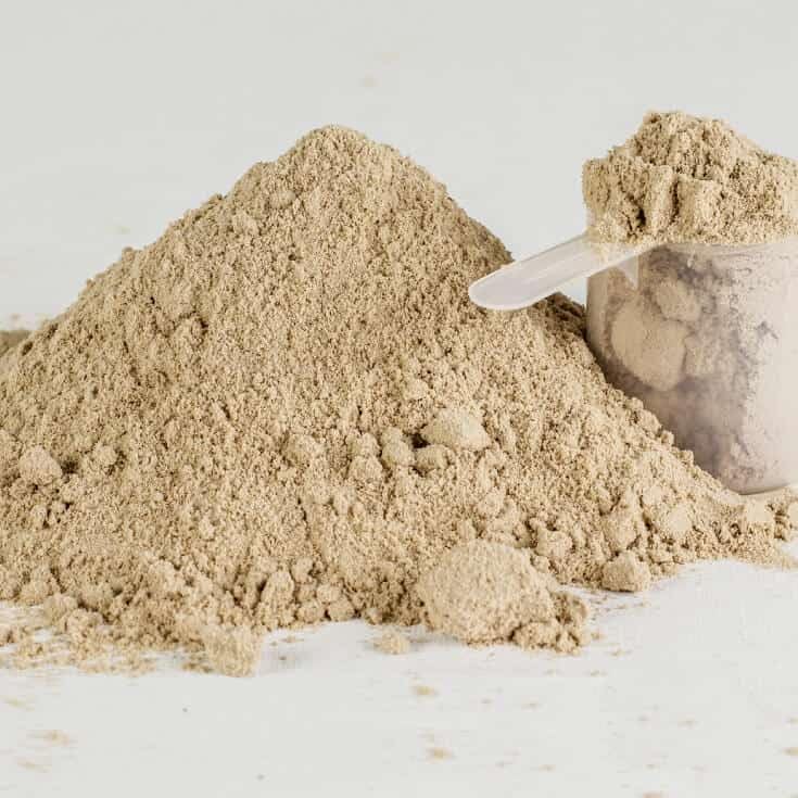 SINGHS Kava powder stirred into tea in a mug for versatile use.