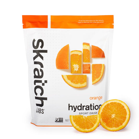 Skratch Labs Hydration Orange bottle being poured for quick electrolyte replacement.